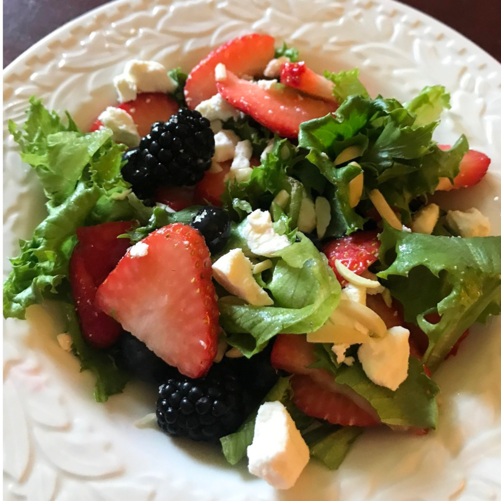 Red White and Blueberry Salad served in a white bowl